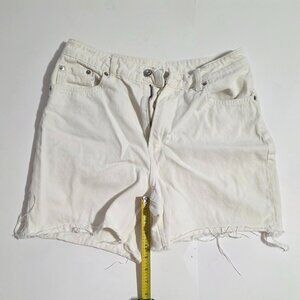 Pre-loved white denim cutoff shorts with a frayed hem